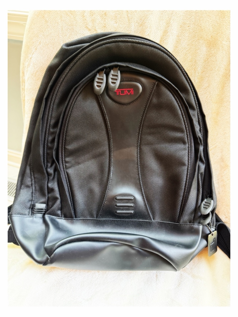 Tumi Black Backpack for Men or Women with Red Logo Accent